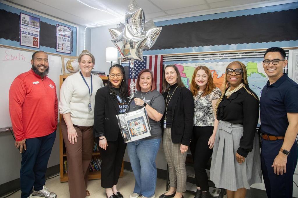  Kara Donnini, an eighth grade history teacher and department lead at Hale Middle School, celebrates being named a 2026 Teacher of the Year finalist on March 12, 2026. 
