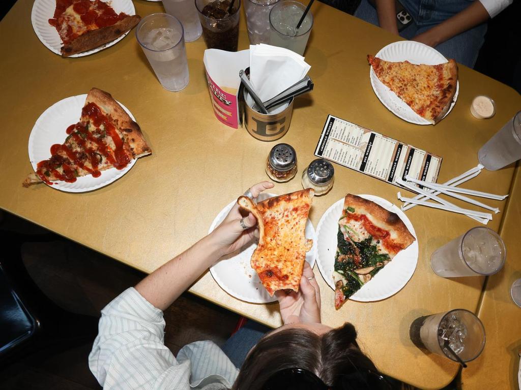 Customers enjoy some classic slices at Empire Slice House.