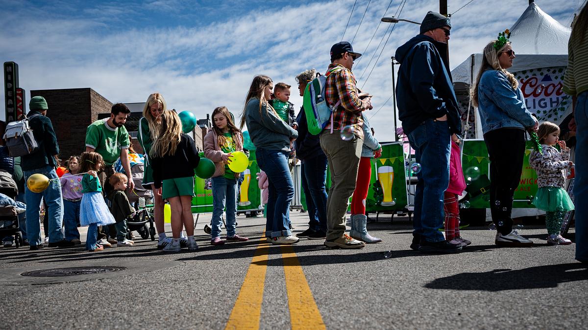 Tulsans wait in line for face painting during the St. Patrick’s Day celebration outside Killkenny's Irish Pub March 17, 2026. The block party included multiple bars, children's activities, music and more.