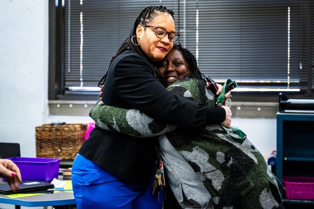 Tulsa Public Schools Superintendent Ebony Johnson, left, hugs Akela Leach after announcing she has been nominated as one of this year's teachers of the the year on Thursday, March 12, 