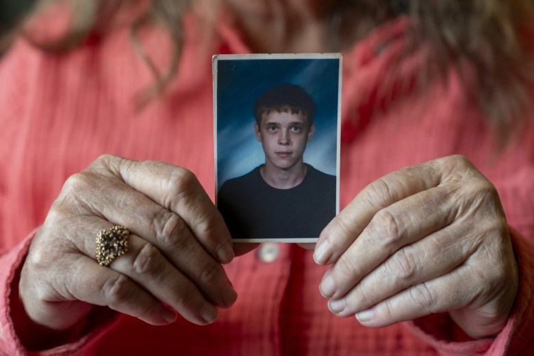 Carla Bonner holds a photograph of her son