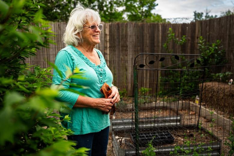 Christy Hartung is photographed in her east Tulsa garden on Wednesday, April 22, 2026. She did all the landscaping and garden construction herself.