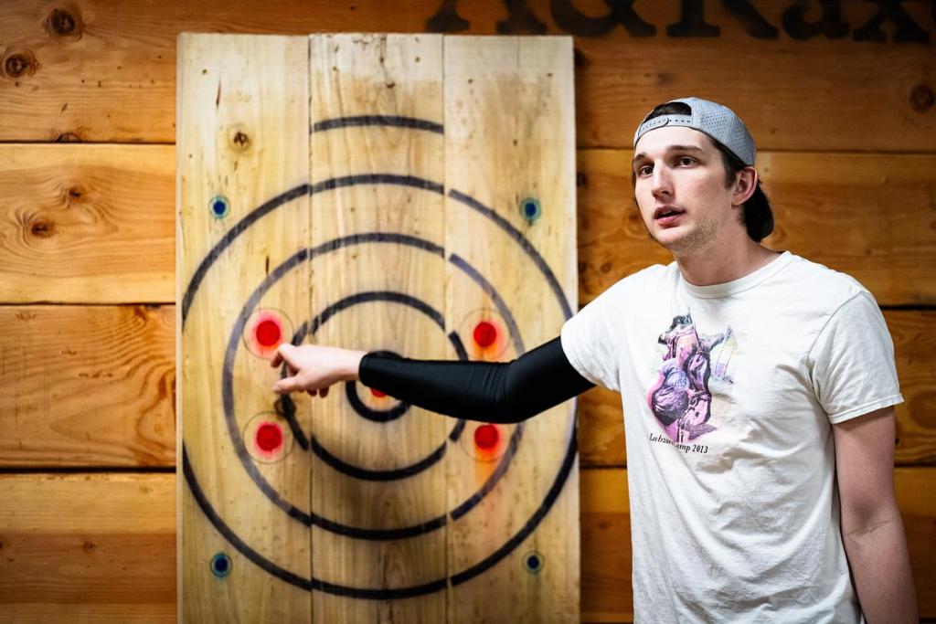 Eli Morton from Claremore explains the scoring of axe and knife throwing at A&R Axe Throwing and Indoor Golf at on Monday, April 13, 2026. Morton is currently ranked number seven in the world and will be competing in the World Axe Throwing Championships this weekend in Tulsa.