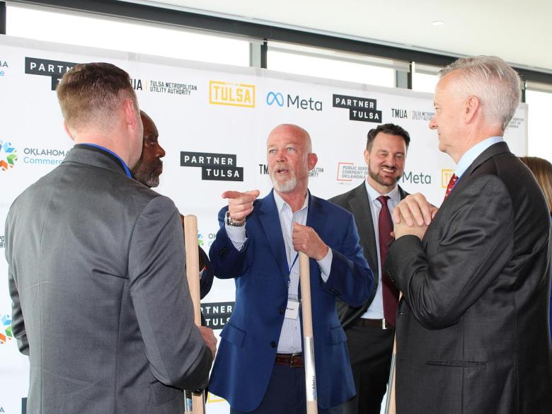 Tulsa City Councilor Christian Bengel, center, celebrates the announcement of Meta as Project Anthem's developer April 21, 2026.