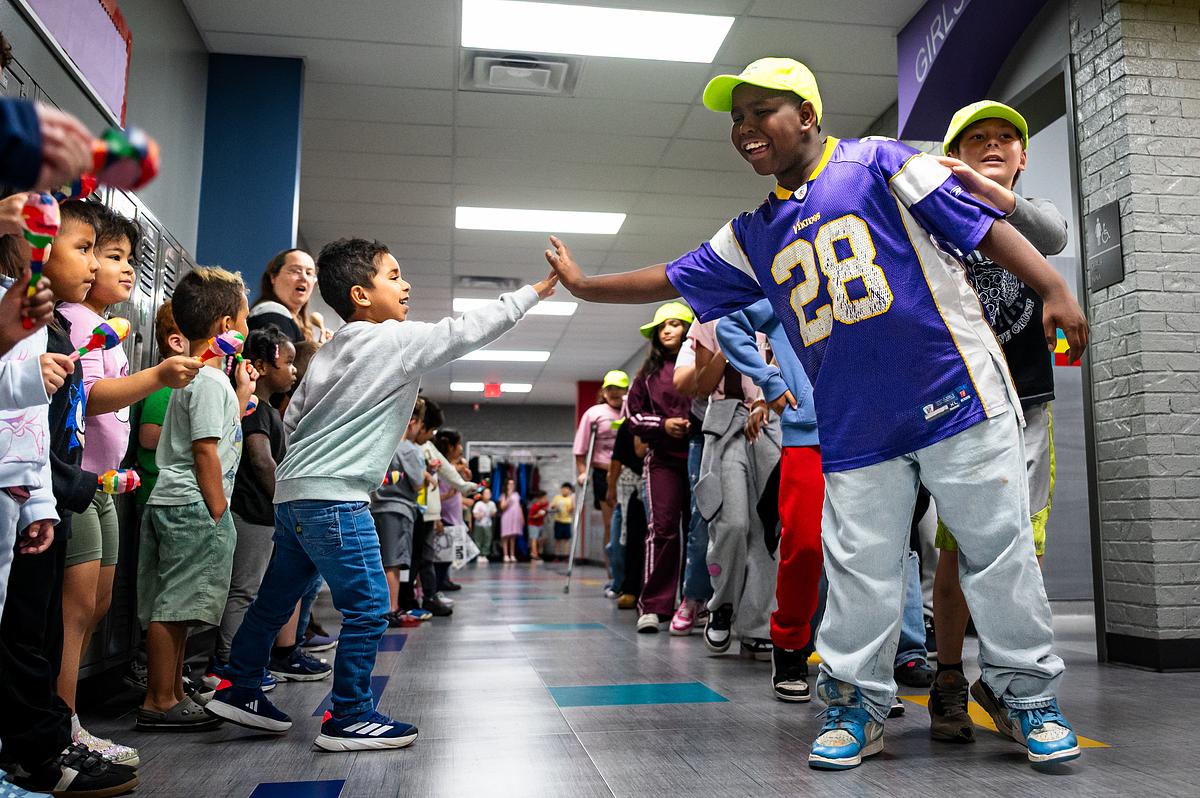 Younger students at Dolores Huerta elementary school, left, cheer on the older students during a testing parade on Friday, April 10, 2026. State testing begins on Monday.