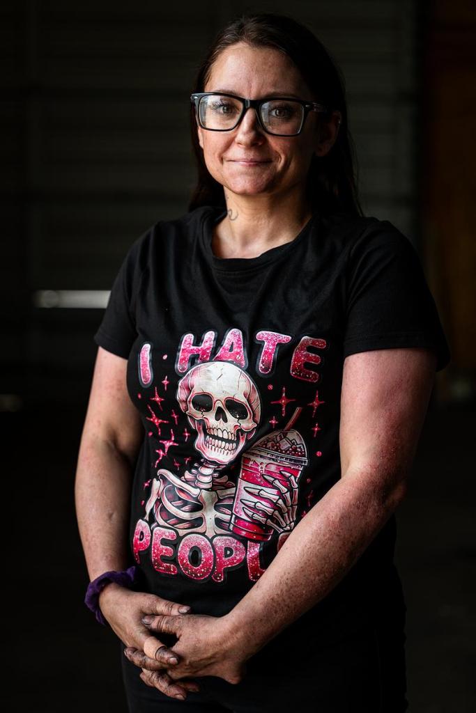 Tephanie Bray stands inside the mechanic shop at Wings of Freedom Saratoga Sober Living Center April 14, 2026. Bray has graduated the program and now works as a mechanic at the center.