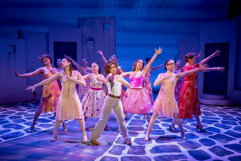 Juliette M. Ojeda as Sophie Sheridan (center) with the Company of "Mamma Mia!"