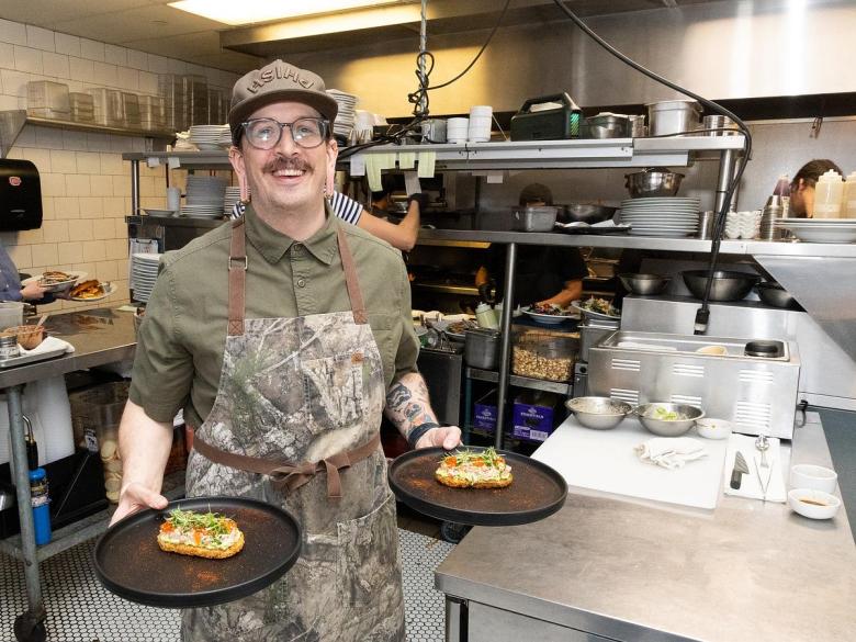 Austin Plumlee, executive chief at The Tavern in Tulsa's Arts District, prepares a course for a Chef's Table experience where a group of diners can enjoy a five-course meal in the kitchen.