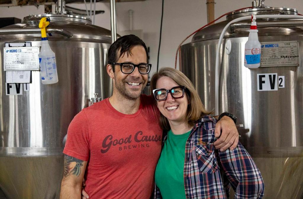 Sally and Andrew Whitney, co-owners of Good Cause Brewing, stand inside their location at 2501 E. 15th St. on April 24, 2026.