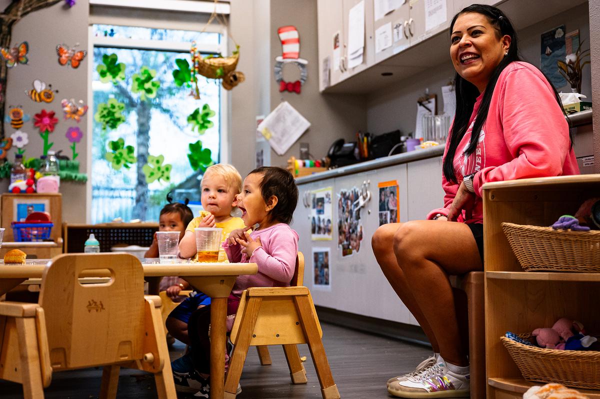 From left: Jakaius Funderburk and Yessenia Trujillo enjoy snack time while their teacher Natalie Hollis smiles at the Crosstown Learning Center on Friday, April 10, 2026.