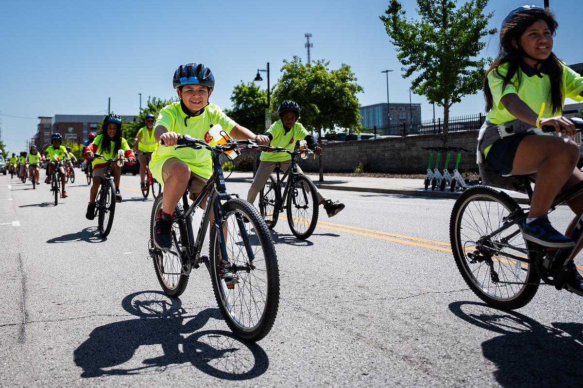 Hundreds of Tulsa Public Schools students ride through downtown during Bike Club's final ride of the year May 13, 2026. The ride started at Hardesty National BMX Stadium and concluded at The Gathering Place.