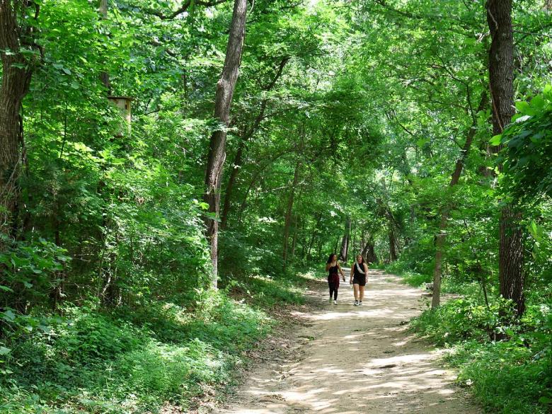 Hikers walk through Ray Harral Nature Park & Center, 7101 S. 3rd St. in Broken Arrow. The city-owned park often hosts events for families.