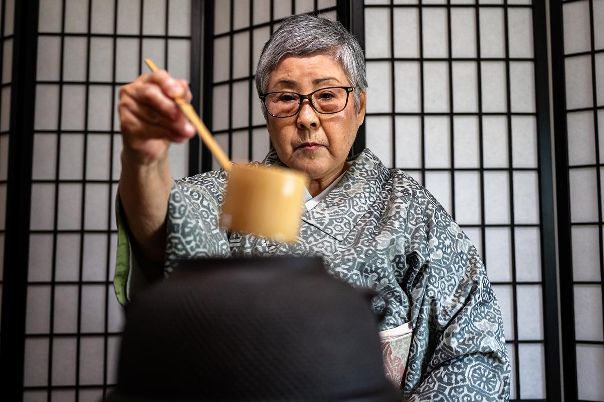 Yumie Farringer scoops hot water during a traditional matcha tea ceremony at her home Tuesday, April 21, 2026. She will perform the ceremony May 16 at Martin Regional Library as part of the 2026 Asian American Festival.