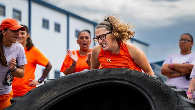 An inmate competes in the tire flip event during the first annual inmate games at Mabel Bassett Correctional Center on Friday, May 15, 2026. The games are meant to boost morale and encourage friendly competition.