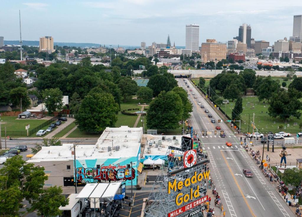 Some of the first cars in the Route 66 Capital Cruise make their way towards downtown Tulsa on 11th Street on May 30, 2026. The cruise was an effort to break a world record for largest classic car cruise.