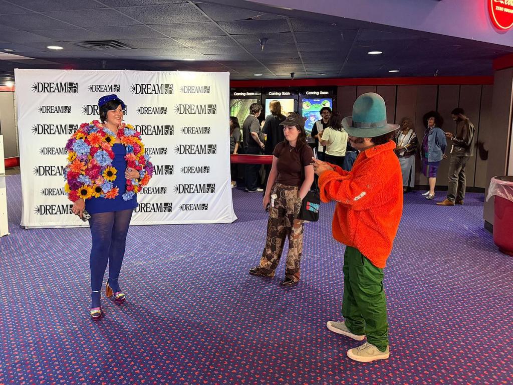 Kinship Frame founder and filmmaker Colleen Thurston gets her portrait taken by filmmaker Boots Riley before the Oklahoma premiere of his "I Love Boosters" at Eton Square 6 on May 9, 2026.