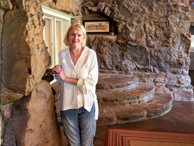 Sandi Dittmann stands for a portrait May 13, 2026, in the main entrance of the Cedar Rock Inn in west Tulsa. Dittmann is the owner of the bed and breakfast off Route 66.