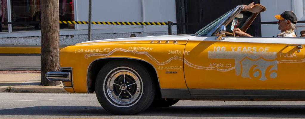A classic car decorated with Route 66's path travels down 11th Street during the Route 66 Capital Cruise on May 30, 2026. The cruise was an effort to break a world record for largest classic car cruise.