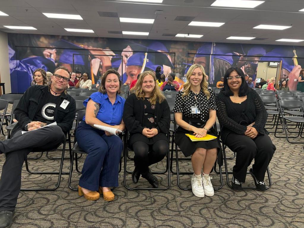 Fifth grader Maisy Archer, center, sits with her parents and Changemakers coaches before speaking to the Tulsa Public Schools board about school meals Monday, May 4, 2026. Her parents Brad Archer and Mary Ellen Solon, left, sat with coaches Leah Robertson and Ariana Hernandez Carrasco, right.