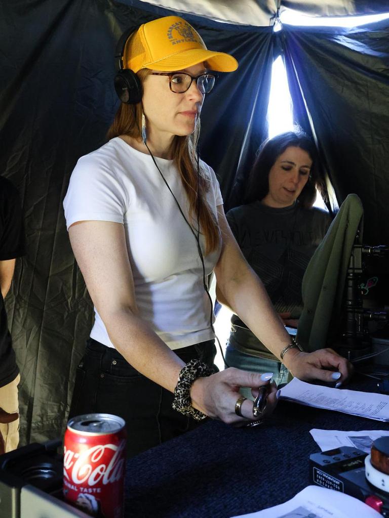 "Saphrona" writer-director Katie Hoffman-Faulk inside video village while a scene is filmed inside the house on May 12, 2026.