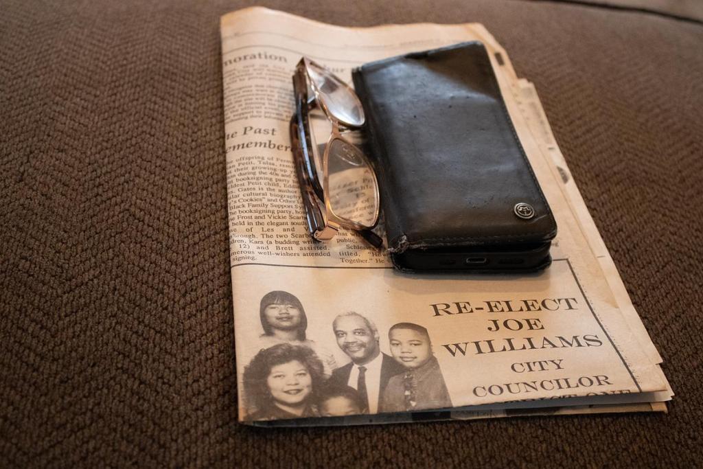 Newspaper articles lay on the table of former Tulsa City Councilor Joe Williams' home showing his campaign for reelection. He was the first Black person to serve as council chair in 1997. 