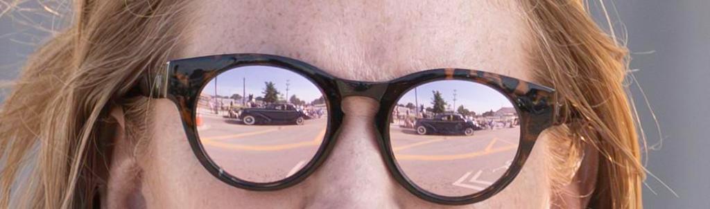 A bystander watches a classic car go by during the Route 66 Capital Cruise on May 30, 2026. The cruise was an effort to break a world record for largest classic car cruise.