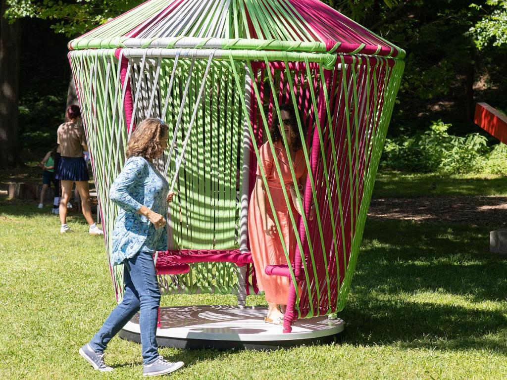 Philbrook guests play around in the temporary interactive exhibit Los Trompos that is located near the Tandy Pavilion. 