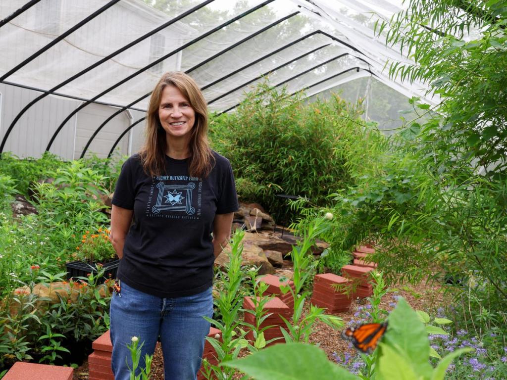 Jane Breckinridge, Euchee Butterfly Farm founder and a Muscogee (Creek) Nation citizen, gives a tour of the facility that includes an aviary on May 21, 2026. 