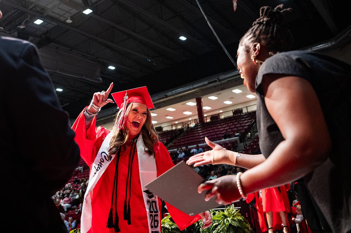 A graduate receives her diploma during the final graduation of Union Adult Learning Center on Tuesday, May 19, 2026. Students either graduated with English as a second language or high school equivalency.