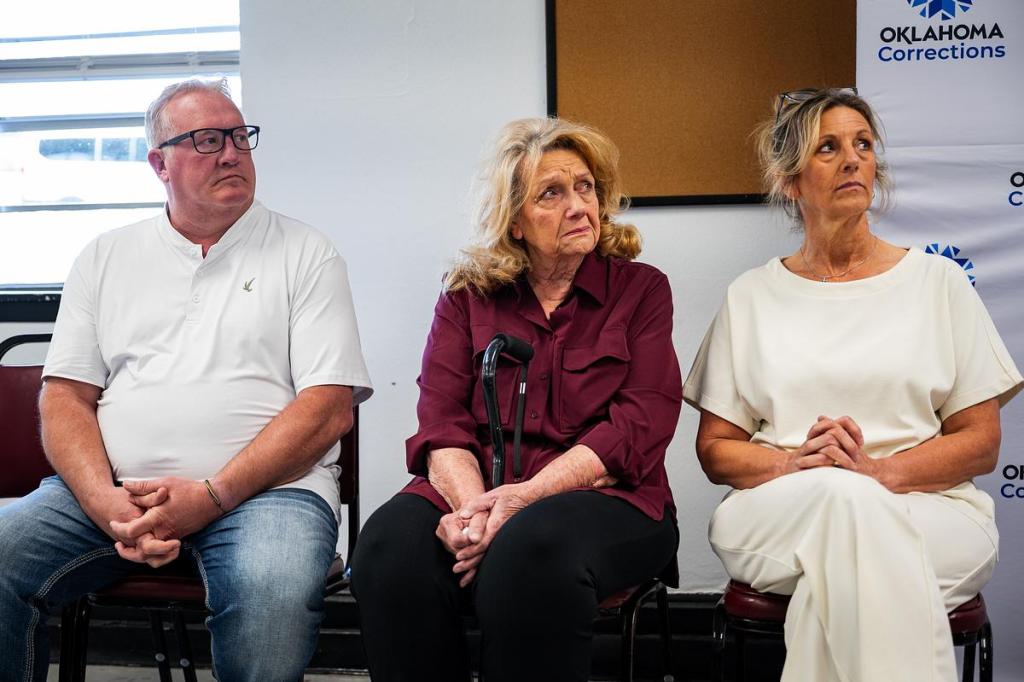 Carolyn Short, center, is surrounded by her family  
during the press conference after Raymond Eugene Johnson’s execution at the Oklahoma State Penitentiary on Thursday, May 14, 2026. She is the mother of Andra, grandma to Brooke and great grandma to Kya. She has lost her first-born daughter, first-born granddaughter and her first-born great-granddaughter. 
