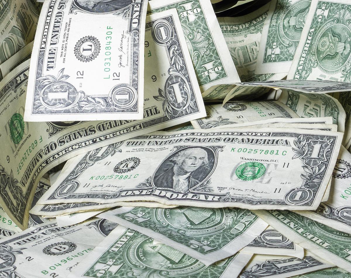 pile of dollar bills