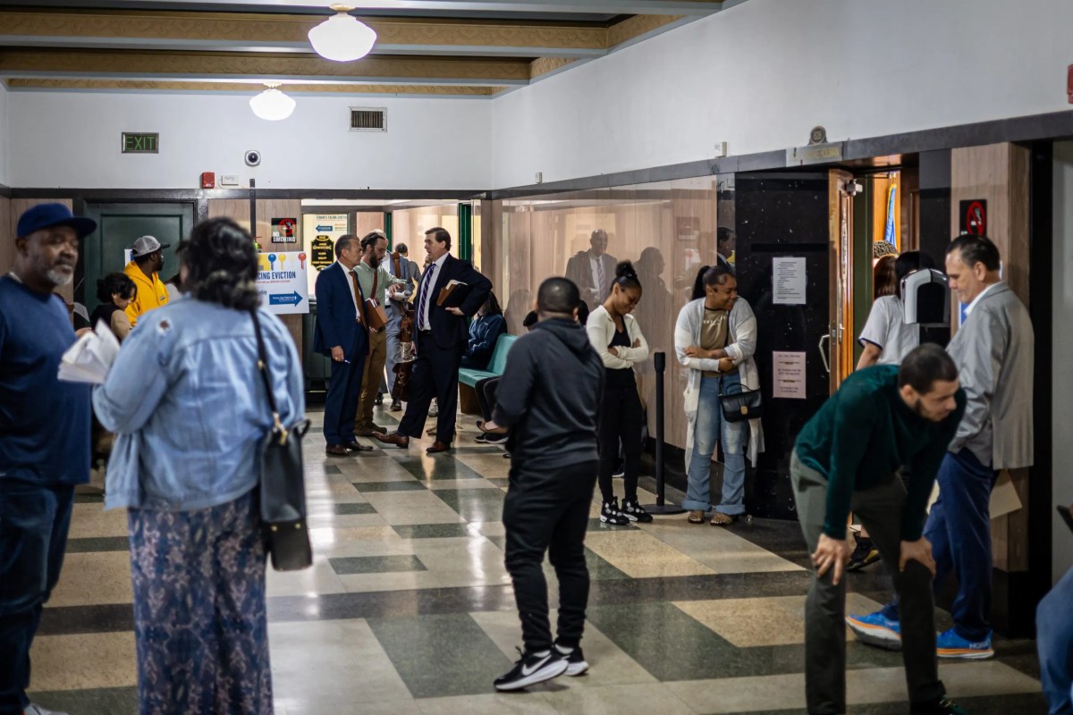 After roll call, tenants, landlords and attorneys linger in the hallway at the Oklahoma County Courthouse on Tuesday, April 27, 2026.