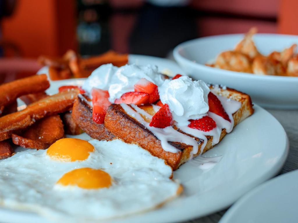 Bramble Breakfast & Bar's strawberry short toast with bacon and eggs on June 25, 2026. 