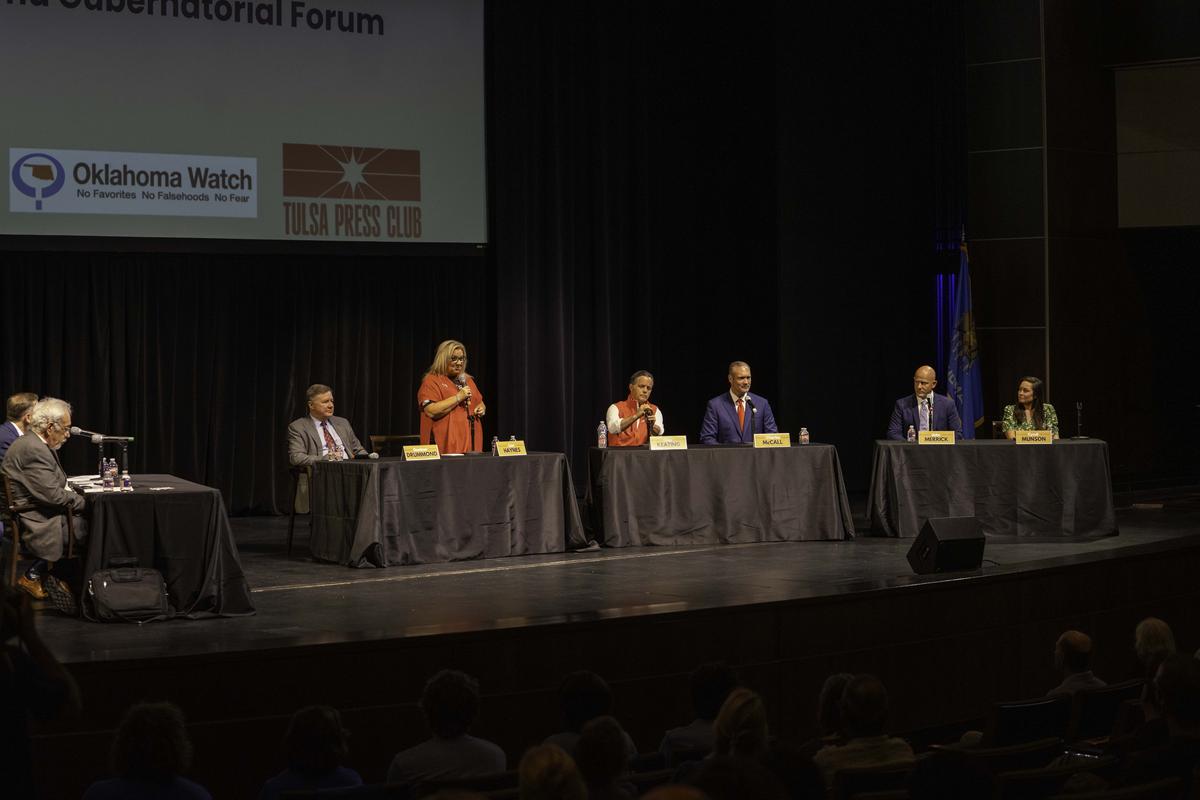 From left to right: Gubernatorial candidates Gentner Drummond, Leisa Mitchell Haynes, Chip Keating, Charles McCall, Chip Merrick and Cyndi Munson appear on stage at a question-and-answer session hosted by the Tulsa Press Club at the University of Tulsa June 2, 2026.