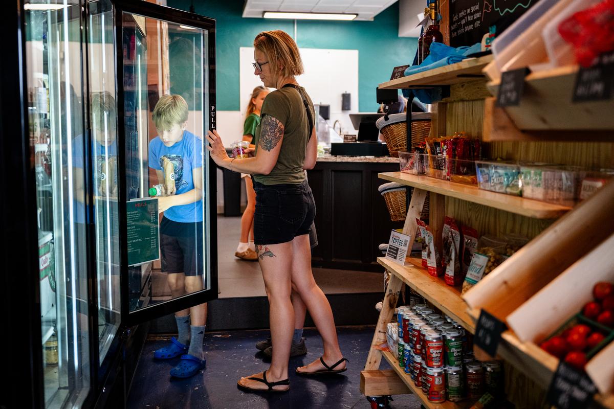 Leon, left and his mom Shannon Wheeler pick out breakfast burritos and juices at Chop Grocer on Thursday, June 25, 2026.