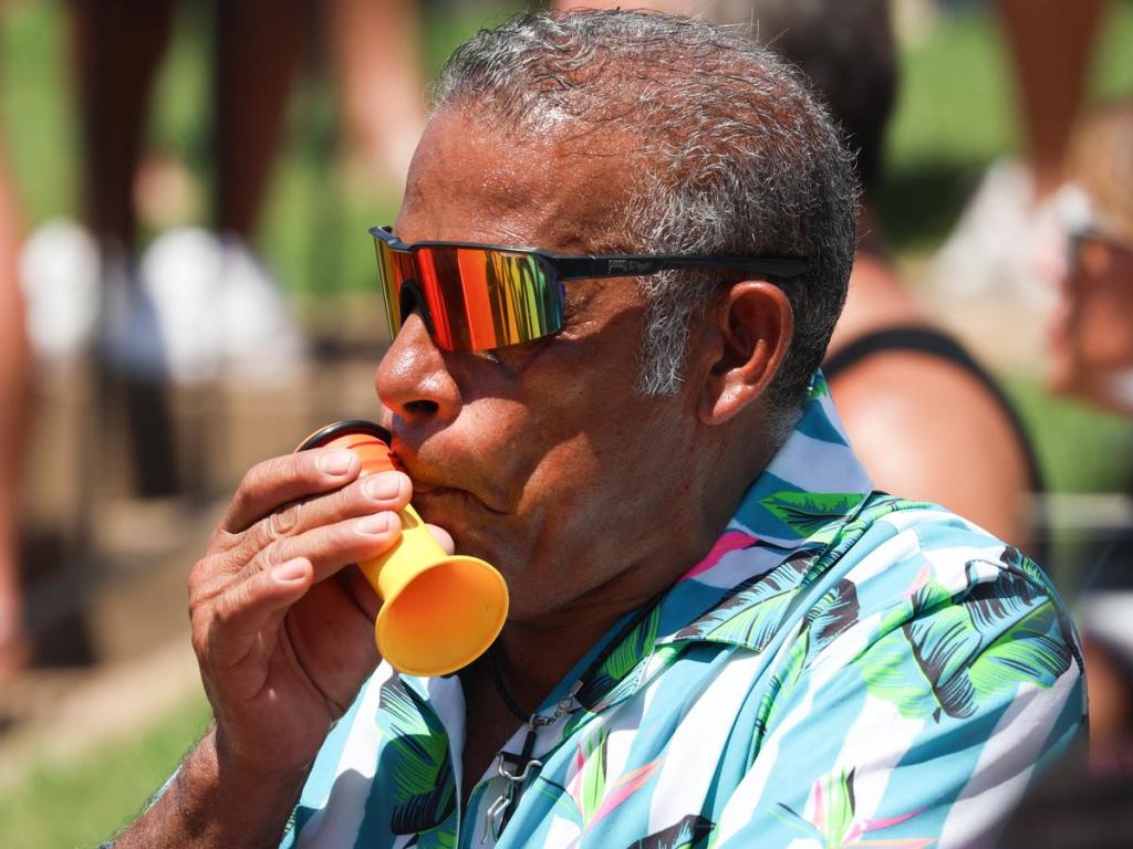 A spectator uses a noise maker during Cry Baby Hill racing during Tulsa Tough on June 8, 2025. 