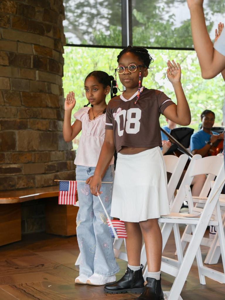 Twenty-two children from 12 countries took their oaths of allegiance at a citizenship ceremony held inside Gathering Place's Williams Lodge on June 11, 2026. 