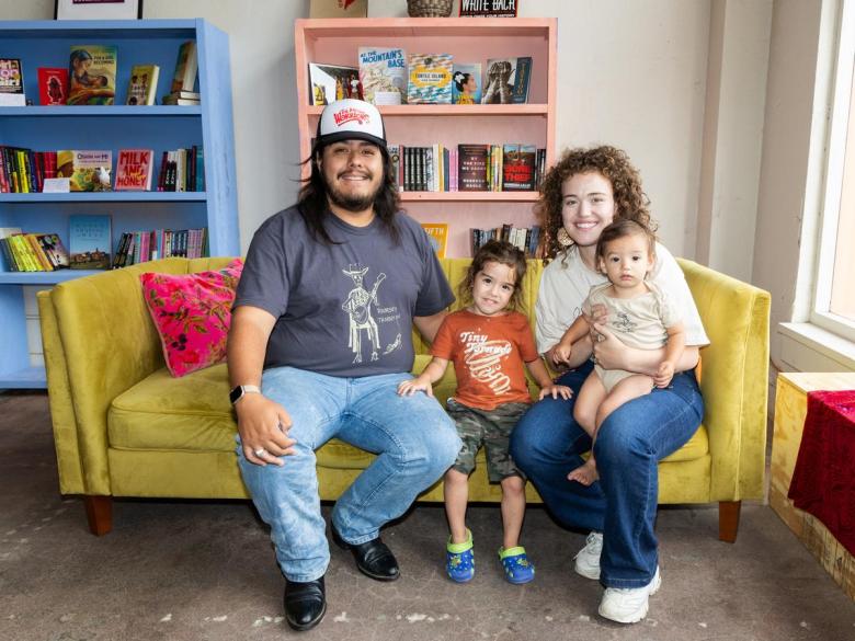 Agalisiga  Mackey and wife Paloma Lopez, joined by their children, Adawelagia and Itztli, sit inside their new bookstore Palomino Books & Music on June 18, 2026.