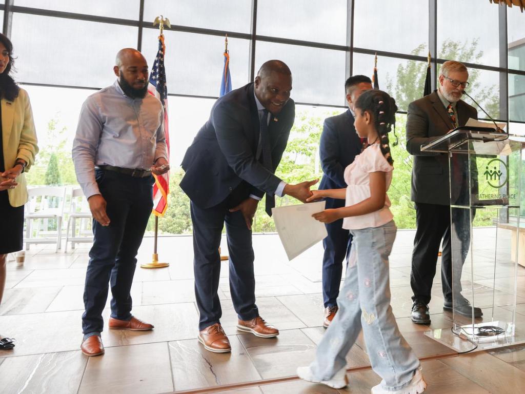 Mayor Monroe Nichols congratulates a new citizen during a ceremony held inside Gathering Place's Williams Lodge on June 11, 2026. 