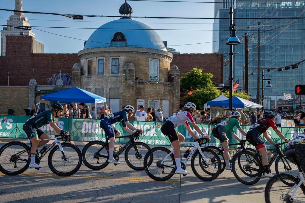 Tulsa Tough racers pass in front of the historic Blue Dome on opening night of the annual summer cycling event, Friday, June 6, 2025.