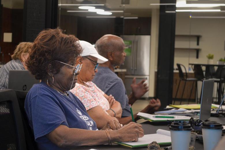 A woman takes notes during a genetic genealogy workshop on June 18, 2026.
