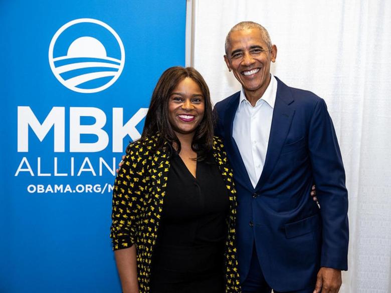Ashley Philippsen poses with former President Barack Obama in 2023. Philippsen is featured in the Obama Center's interactive art exhibit.