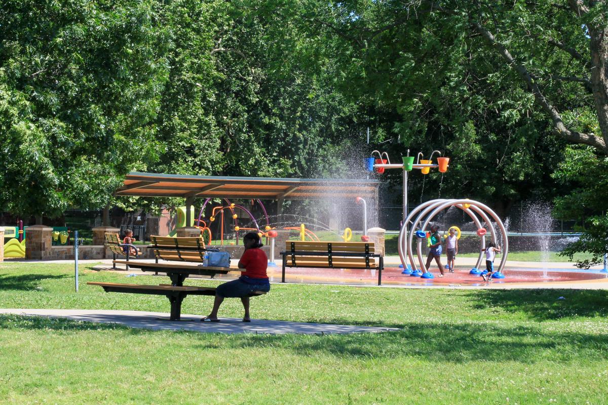 A family beats the heat in the splash pad at at the Lacy Park on Wednesday June 17, 2026.