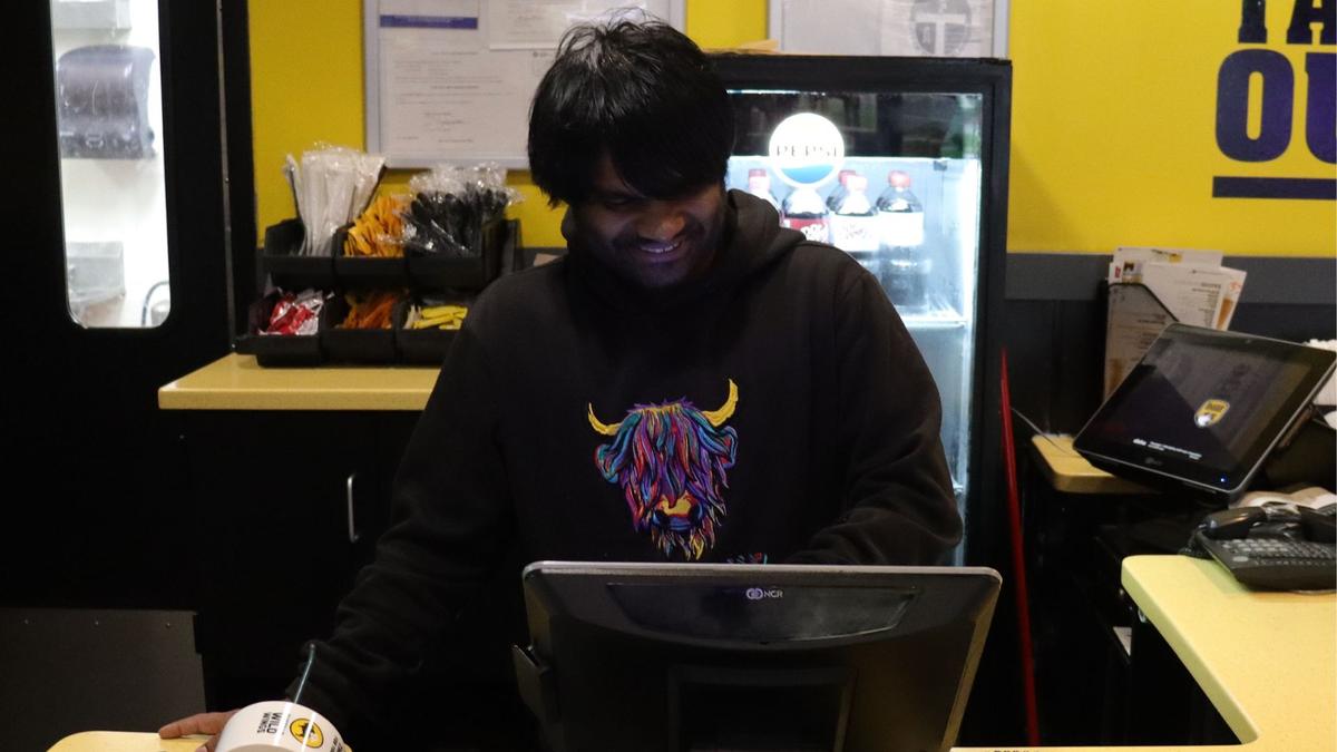 Dylan Ramer makes around $13 an hour at Buffalo Wild Wings. The Tulsa Community College student says raising the minimum wage would make a big difference for his finances.
