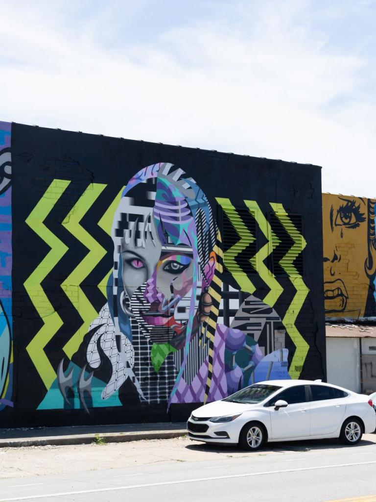 A mural created by Zuwae & Qumes for Habit Mural Festival that can be seen on East Sixth Street near Trenton Avenue.