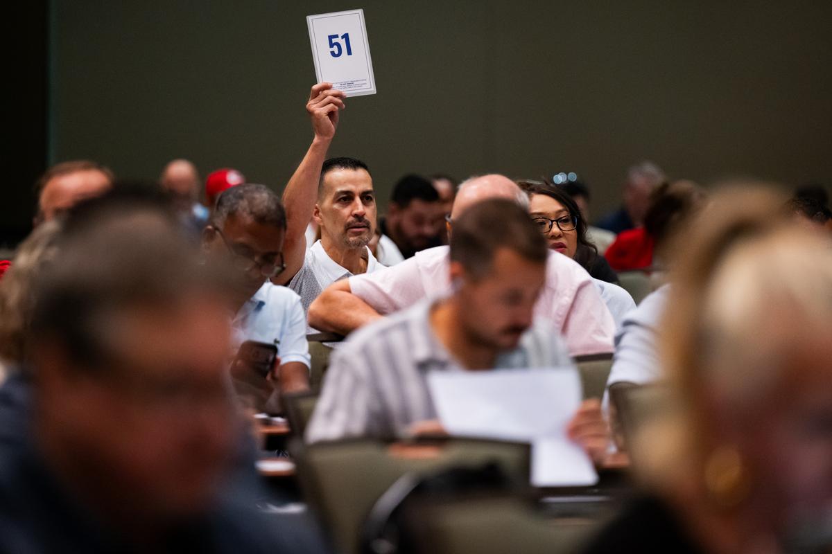 Attendees bid during the annual Tulsa County Treasurer's property sale at the Arvest Convention Center June 8, 2026. These properties have been taken over by the Treasurer after the owner has not been able to pay the property taxes for three years.