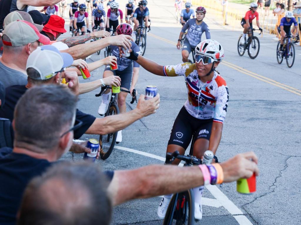 Spectators offer up beers to Tulsa Tough competitors after they finish racing on June 7, 2025. 