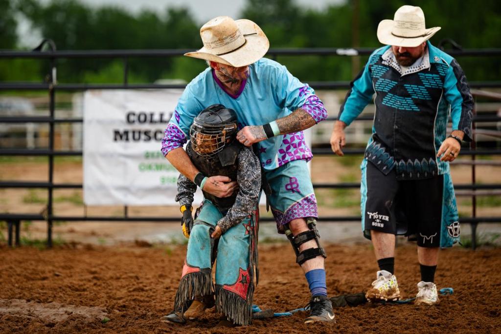 A young cowboy receives help taking his helmet off during the Muscogee Nation Festival in Okmulgee on Thursday, June 25, 2026.