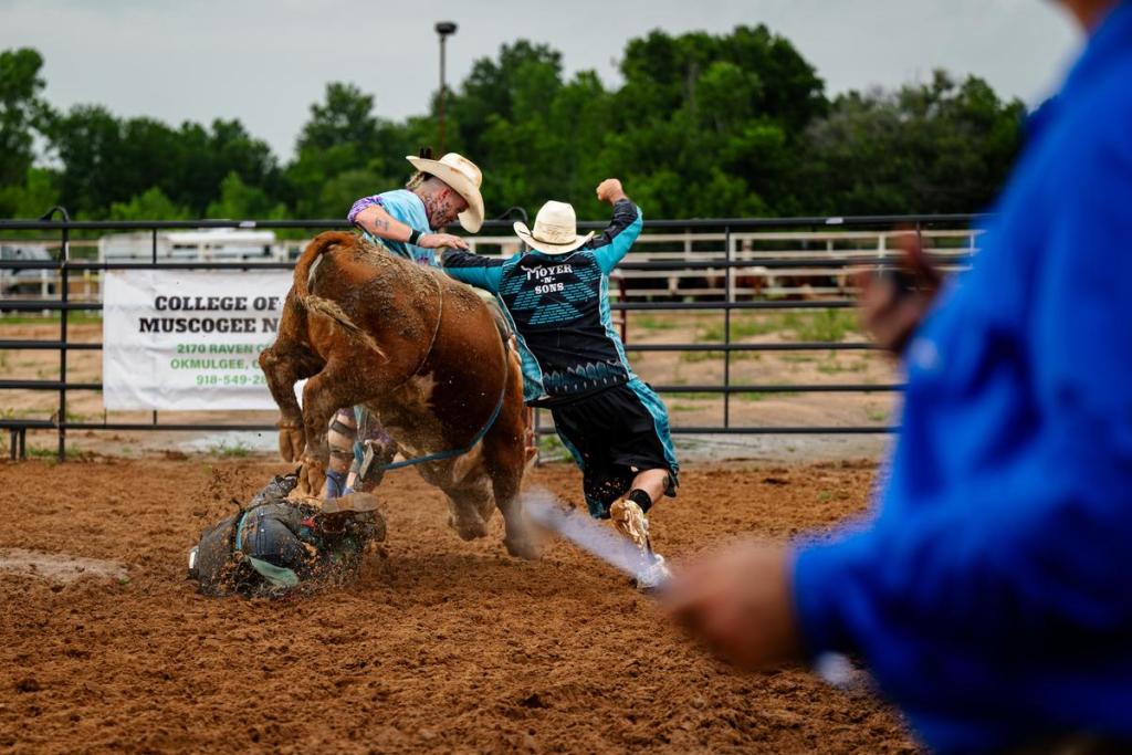 A young cowboy gets kicked by a bull during the Muscogee Nation Festival in Okmulgee on Thursday, June 25, 2026.