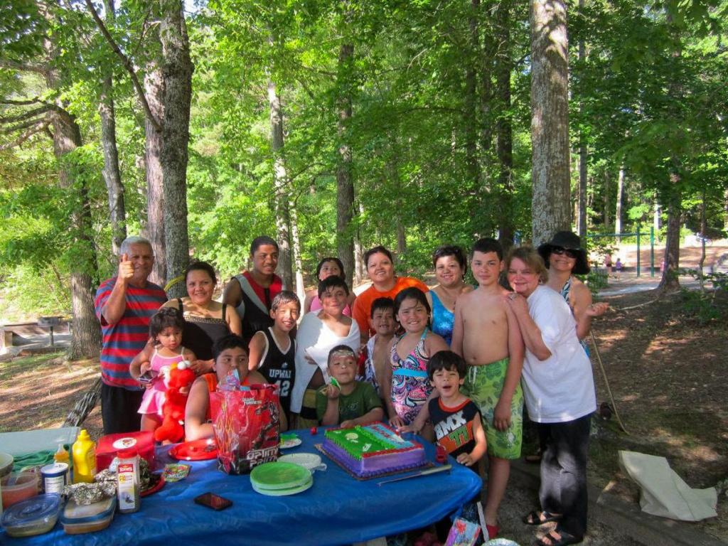 Oscar Guillén Arauz, far right, stands for a picture with his family during a Fourth of July celebration. Guillén Arauz immigrated to the U.S. from Honduras with his mother and grandmother when he was 2 years old. 